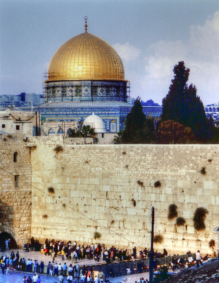 The Western Wall, Old City of Jerusalem. Dome of the Rock was erected by the Muslim ruler Abd el-Malik in 688-691 - Jerusalem, Israel