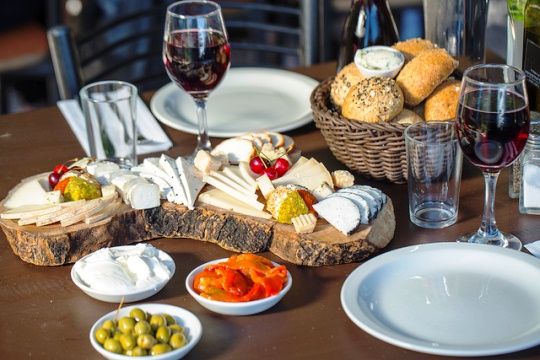 This is a typical Israeli breakfast.  Fresh bread, a variety of hard and soft cheeses, fresh juice, olives, jam and butter are all regulars on the Israeli breakfast plate.